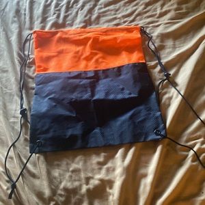 Orange and black drawstring bag